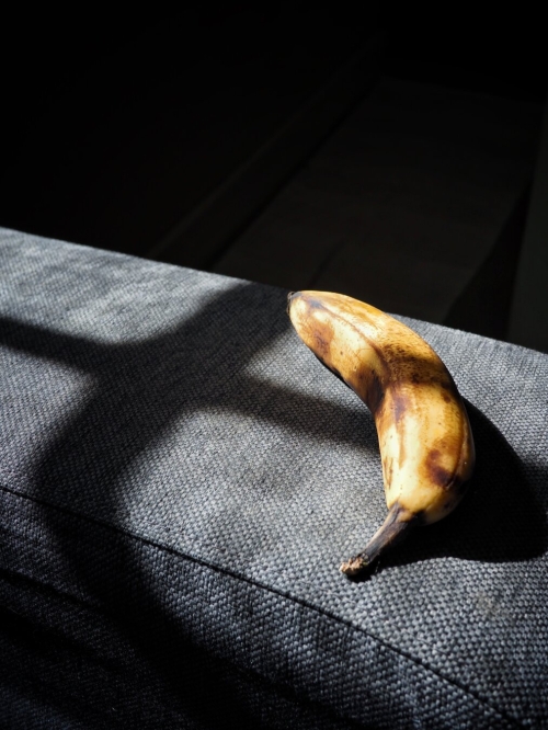 Sunlight, shadows and a banana that will soon be eaten.